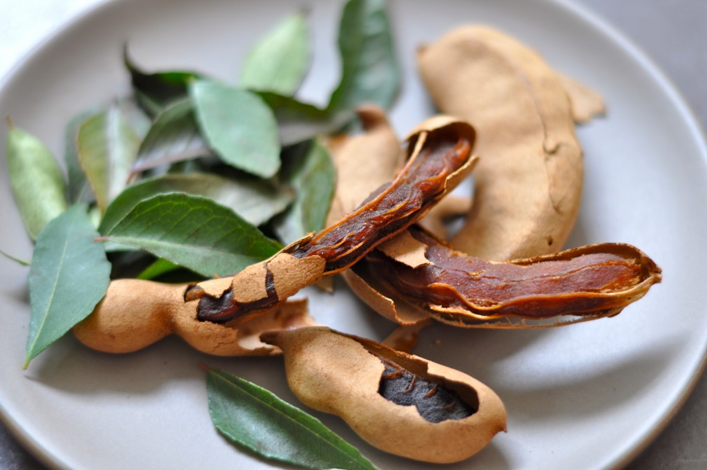 Tamarind pods and curry leaves give rasam broth a lemony-sweet tang and a subtle bitter flavor